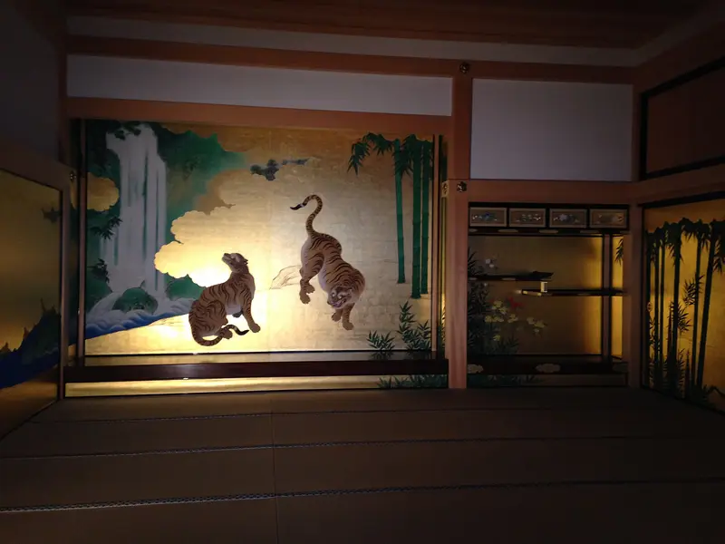 Gold-leaf sliding doors painted with tigers in a bamboo grove, inside Honmaru Palace